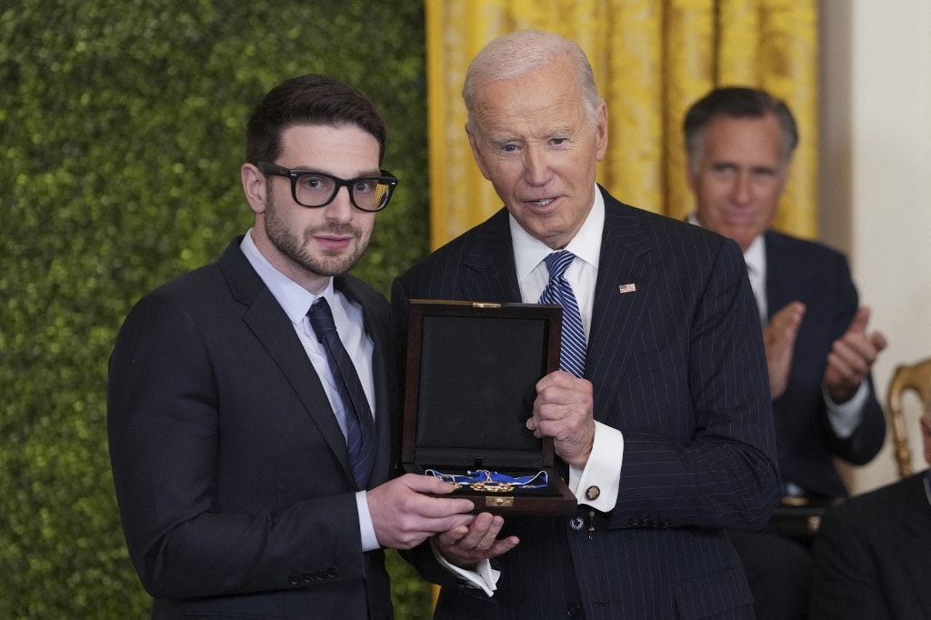 George Soros son Alex Soros collecting the medal on his behalf. 