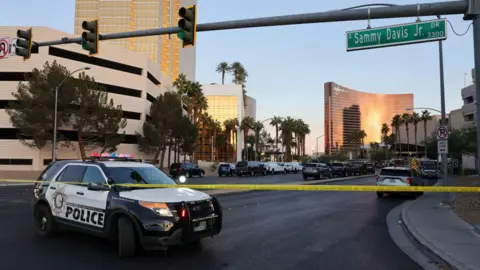 Getty Images A police care blocks the road near the Trump International Hotel in Las Vegas