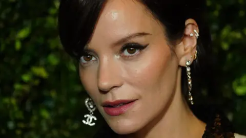 PA Close up of Lily Allen with dangly earrings