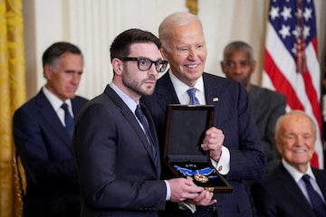 Alex Soros receives the Presidential Medal of Freedom from U.S. President Joe Biden on behalf of his father George Soros, during a ceremony in the East Room of the White House, in Washington, U.S. January 4, 2025. REUTERS/Ken Cedeno