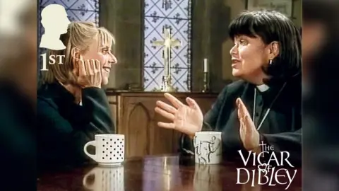 Royal Mail Iconic scene of Alice played by Emma Chambers with a blonde bob and Geraldine Granger starring Dawn French with a dark haired bob and wearing a vicars outfit.