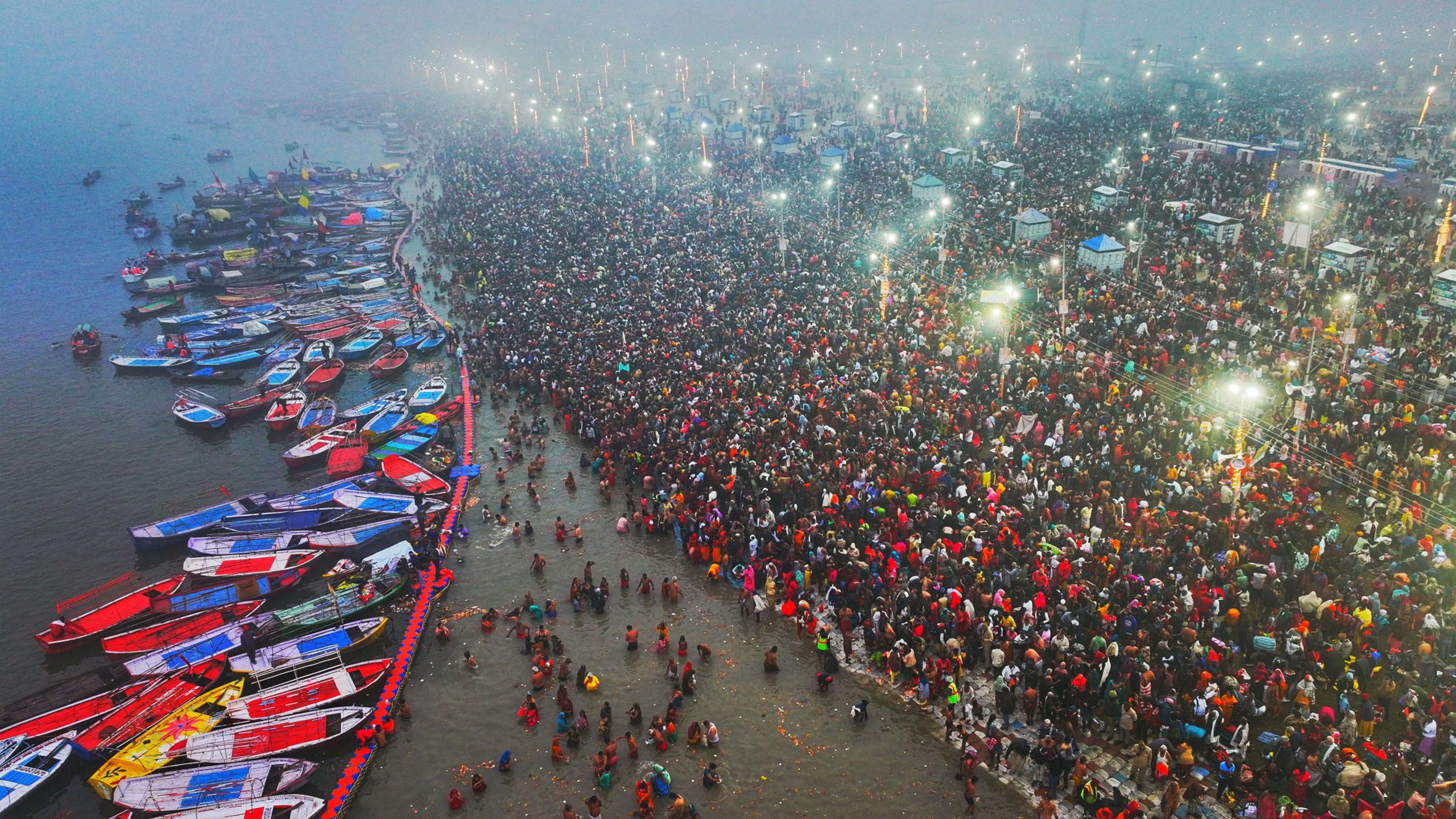 Devotees take a holy dip at Sangam during Maha Kumbh Mela 2025