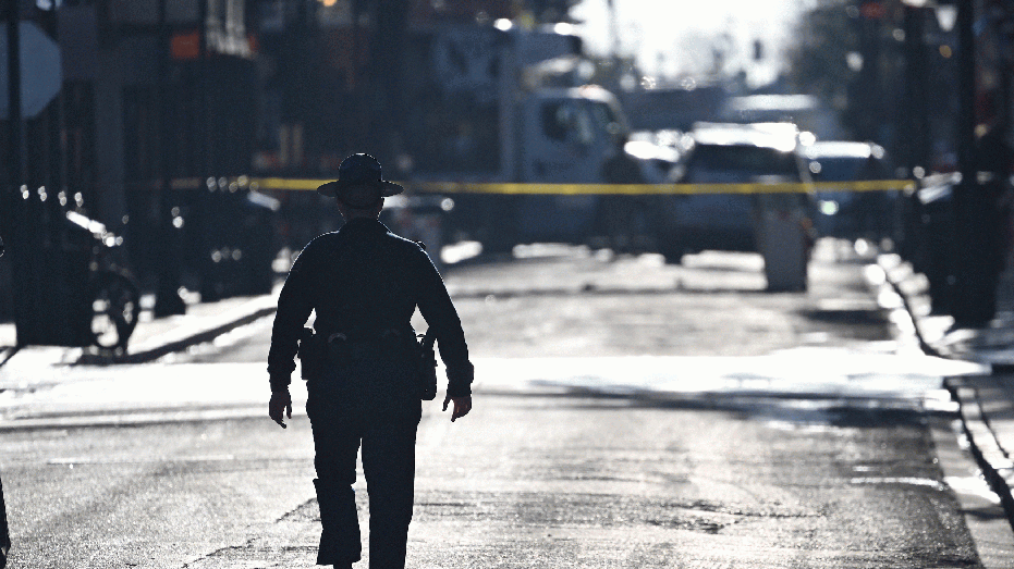 A police officer patrols the French Quarter, after an attack by a man driving a truck down Bourbon street the day before, early on January 2, 2025 in New Orleans, Louisiana. At least 10 people were killed and 30 injured Wednesday when a vehicle plowed overnight into a New year's crowd in the heart of the thriving New Orleans tourist district, authorities in the southern US city said. (Photo by ANDREW CABALLERO-REYNOLDS / AFP) (Photo by ANDREW CABALLERO-REYNOLDS/AFP via Getty Images)