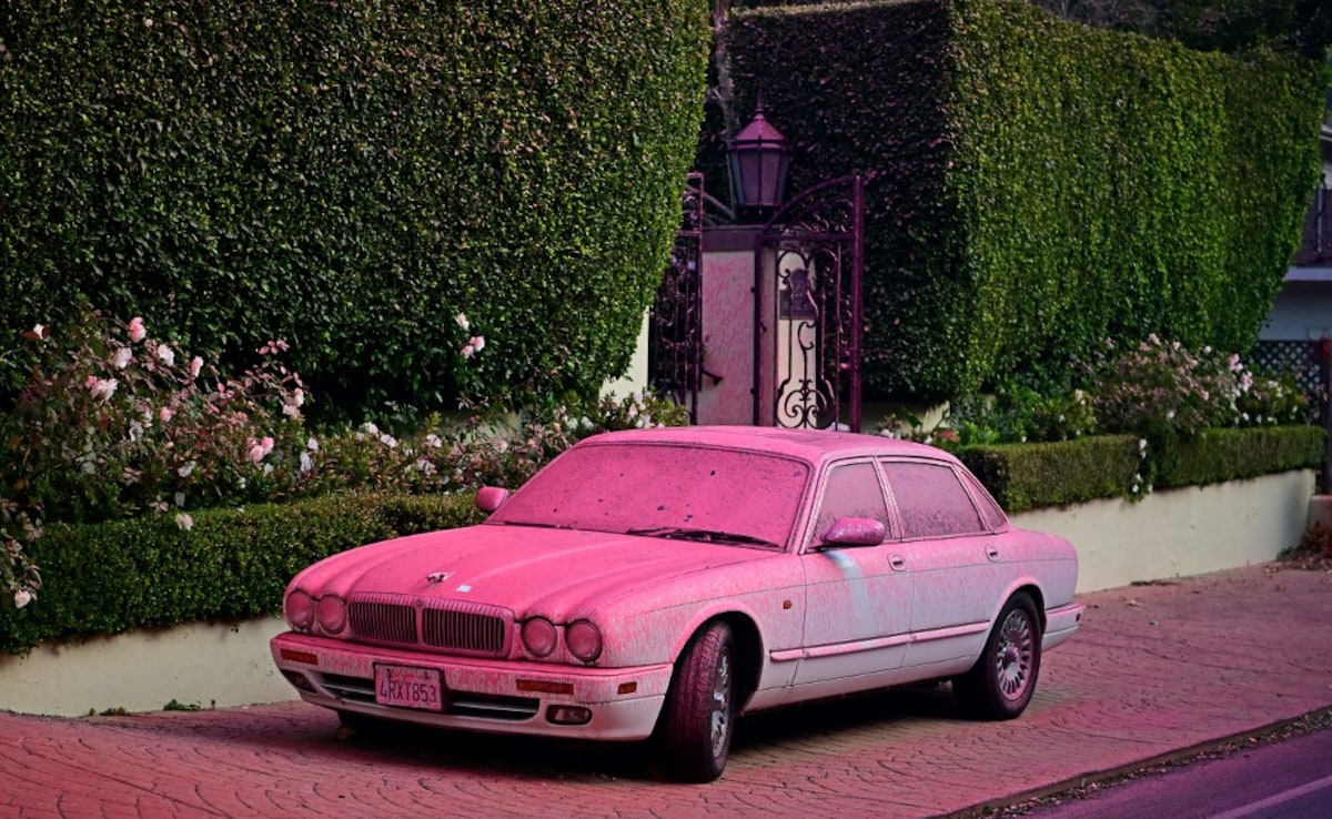 Red flame retardant is seen on a car in the Mandeville Canyon neighborhood of Los Angeles