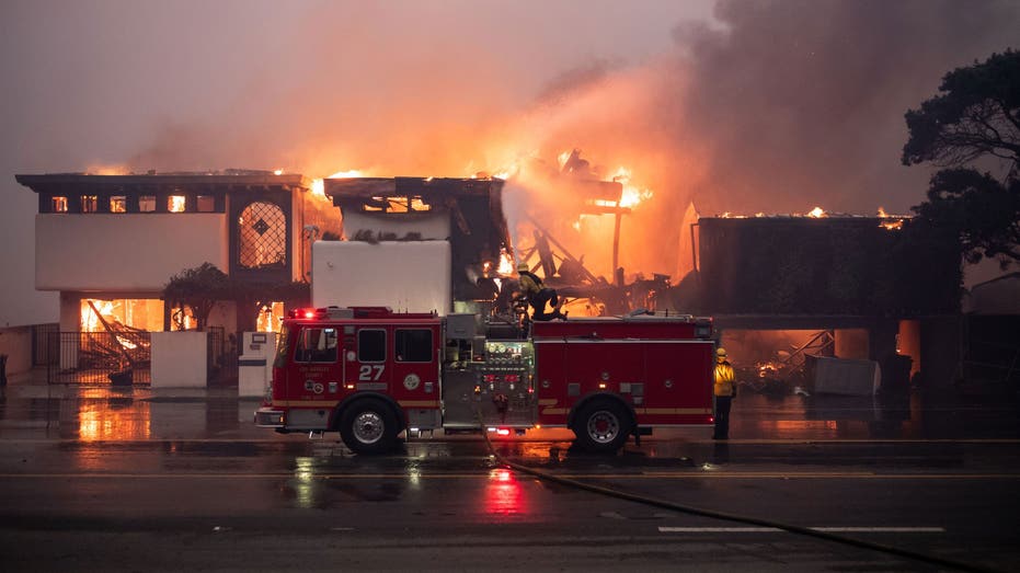 MALIBU, CA - January 08: Firefighters continue to battle wind and fire as homes go up in flames in Malibu along Pacific Coast Highway near Carbon Canyon Road in the Palisades Fire on Wednesday, January 8, 2025 (Photo by David Crane/MediaNews Group/Los Angeles Daily News via Getty Images)