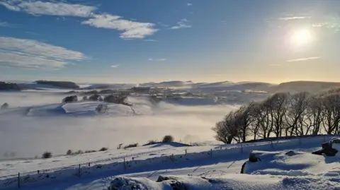 BBC Weather Watchers/Cheryl Doran A field covered in snow and fog