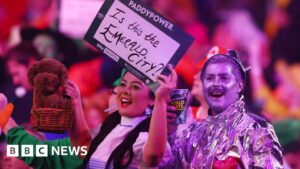 Dart fans on the pantomime of watching live