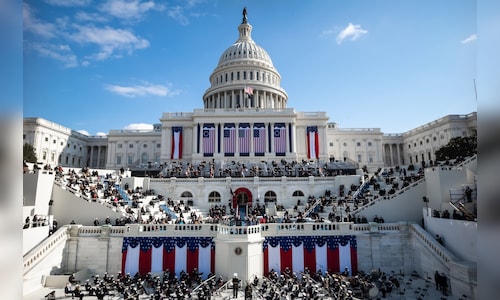 Why are US flags being flown at half-staff on Inauguration Day?